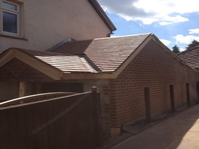 Completed roof and external walls of extension. Doors and internals to finish.